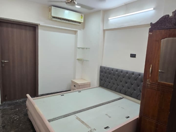 Fully furnished 2BHK apartment with open view in Manju Tower, Lokhandwala Andheri West, suitable for corporate tenants and bachelors.