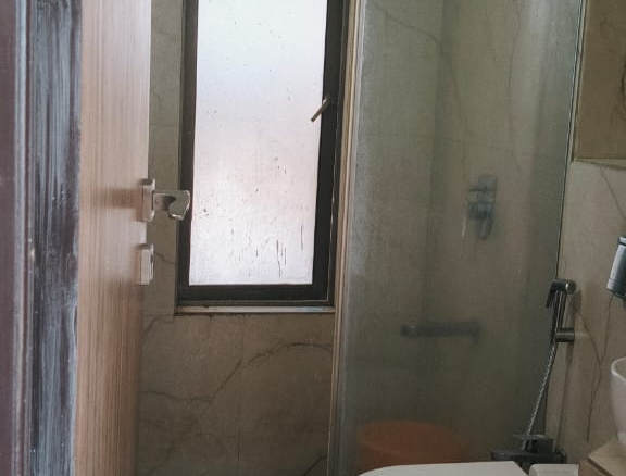 Spacious master bedroom with wardrobe and bed in single occupancy 2 BHK Andheri West