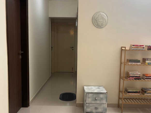 Single furnished room for rent in 4BHK apartment at Evershine Cosmic Andheri West Mumbai with private washroom, AC, bed, study table, cupboard, and high floor city view for male single occupancy.