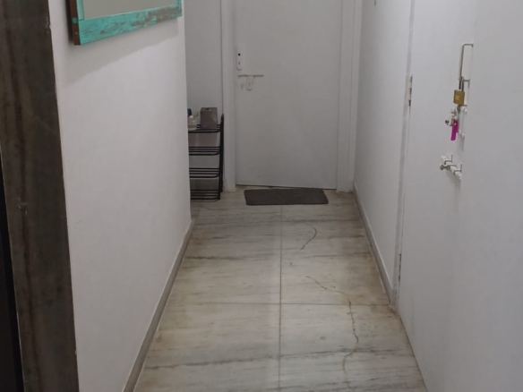 Independent fully furnished private room for rent in Andheri West Mumbai with bed, mattress, AC, wardrobe, private washroom, equipped kitchen, maid service, and gated high-rise apartment for working professional.